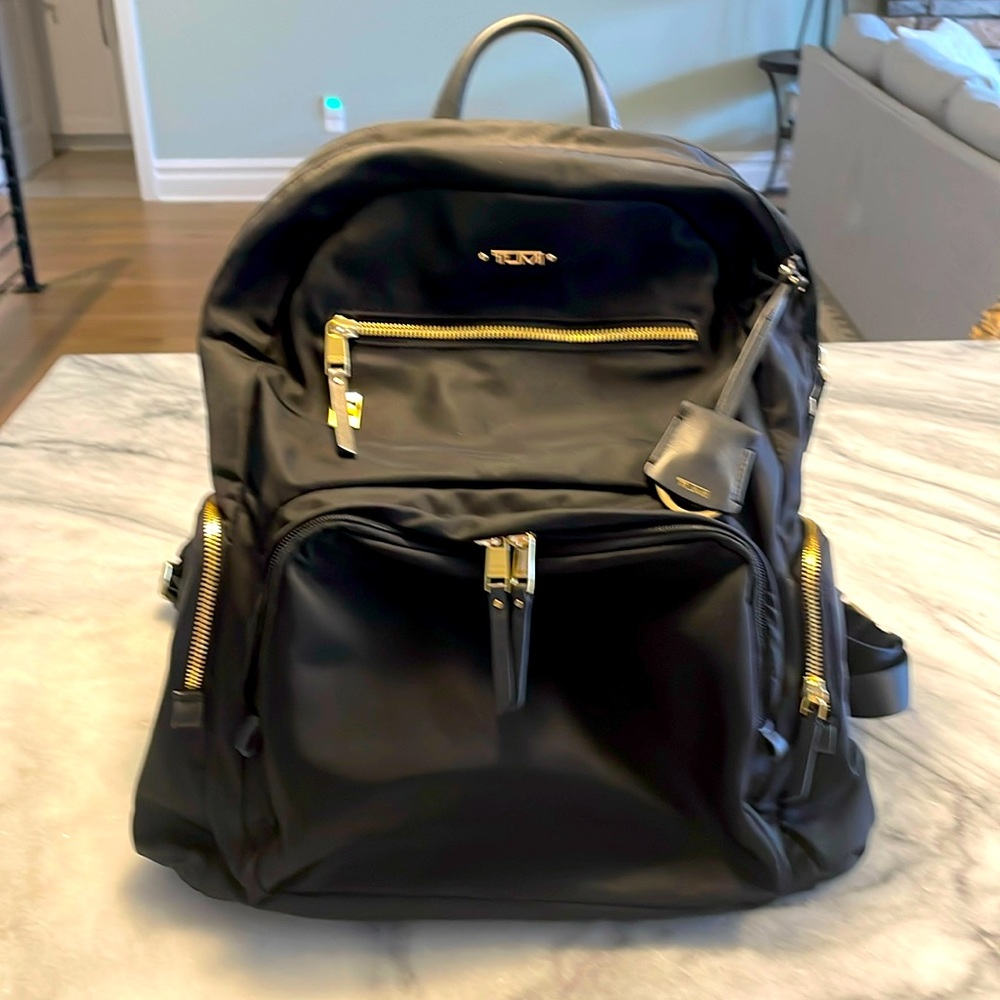 Tumi Black Nylon Backpack with Gold Hardware used for a year